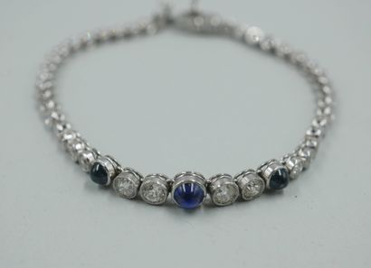null 
Soft bracelet in platinum and 18k white gold decorated with three cabochons...