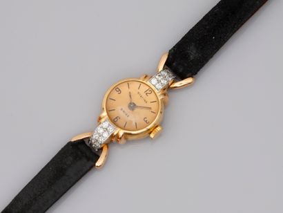 null Lady's watch in 18k yellow gold with domed glass, the case decorated with platinum...