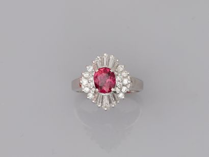 null 
Platinum skirt ring set with an oval ruby and marquise-cut diamonds in a double...