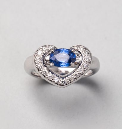 null Modern ring in 18k white gold surmounted by a sapphire surrounded by a line...