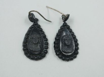 null Pair of drop-shaped earrings adorned with a cameo portrait of a woman in imitation...
