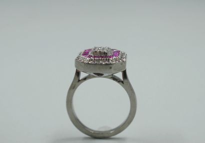 null Octagonal silver ring set with a line of calibrated rubies and paved with diamonds....