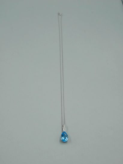 null 18k white gold pendant set with a pear-shaped Swiss Blue topaz of about 3.50cts,...