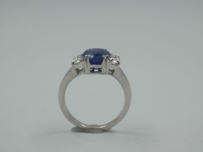 null 18k white gold ring with a 2cts sapphire and two marquise cut diamonds. 

PB...
