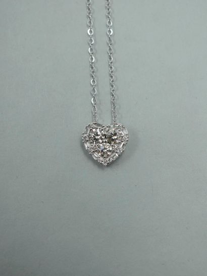 null 18k white gold heart pendant set with three brilliant-cut diamonds in a setting...