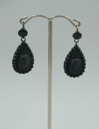 null Pair of drop-shaped earrings adorned with a cameo portrait of a woman in imitation...