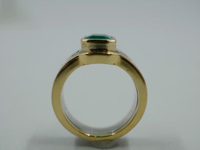 null 18k gold ring set with a square Colombian emerald and a line of baguette-cut...