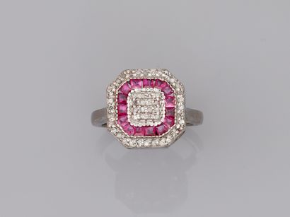 null Octagonal silver ring set with a line of calibrated rubies and paved with diamonds....