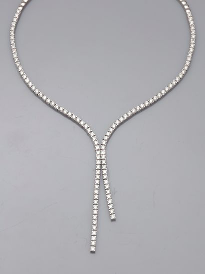 null 
MESSIKA, Paris.





Magnificent river of diamonds forming a tie in 18k white...