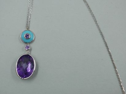 null 18k white gold pendant set with a turquoise cabochon centered on an amethyst...