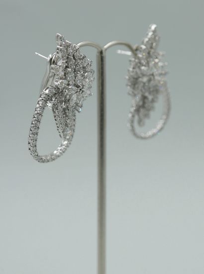null Pair of 18k white gold earrings with a flower motif set with marquise-cut diamonds...
