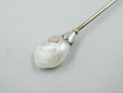 null White gold / platinum lapel pin topped with a fine natural baroque pearl and...