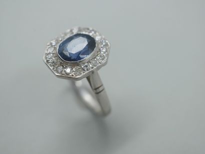null Octagonal ring in 18k white gold set with a sapphire surrounded by brilliant-cut...