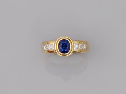 null 14k yellow gold ring set with a sapphire and six princess cut diamonds.

PB...
