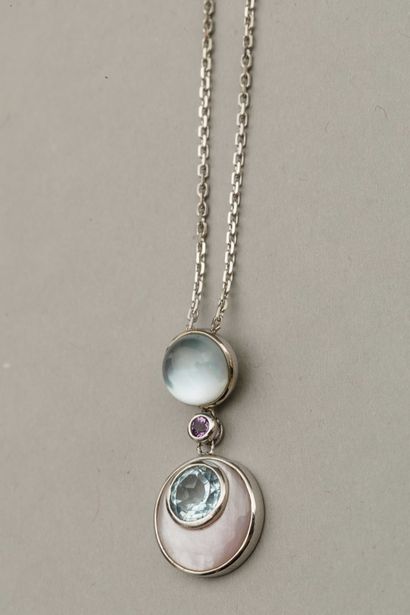 null 18k white gold pendant set with a cabochon blue topaz supporting a small amethyst...