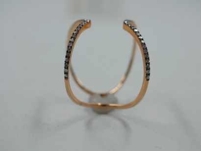 null 18k rose gold ring formed of pinched lines on the top partially set with diamonds.

PB...