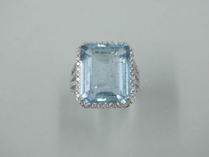 null 18k white gold ring set with a large rectangular aquamarine of about 13cts encircled...