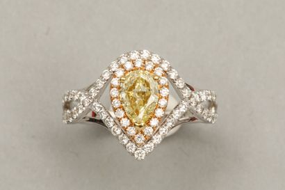 null 18k white gold pear ring set with a 0.60ct pear-shaped champagne diamond surrounded...