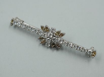 null 18k white gold brooch set with a flower motif set with marquise-cut brown diamonds...