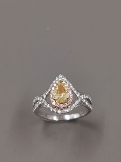 null 18k white gold pear ring set with a 0.60ct pear-shaped champagne diamond surrounded...