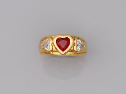 null 18k yellow gold ring set with a heart-shaped ruby of about 1ct and heart-shaped...