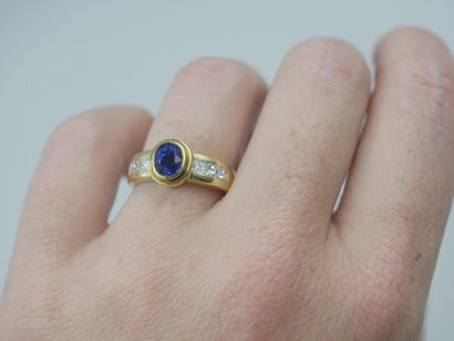 null 14k yellow gold ring set with a sapphire and six princess cut diamonds.

PB...