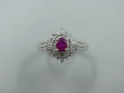 null 18k white gold flower ring set with a natural oval ruby of 0.30cts in a setting...