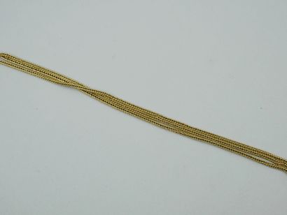 null Bracelet souple en or jaune 18k à trois rangs de mailles. 

Long. : 8,2 cm env....
