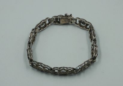 null Silver bracelet with openwork oblong links, decorated with cut marcasites. 

Work...