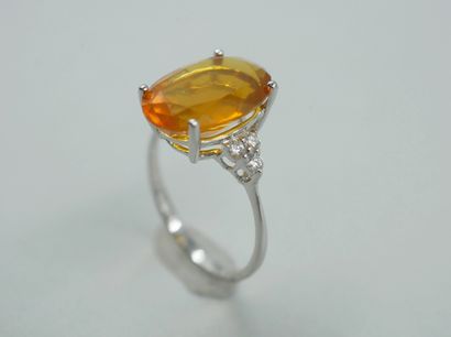null Ring in 18k white gold with an oval fire opal of 3.50cts and six diamonds. 

PB...