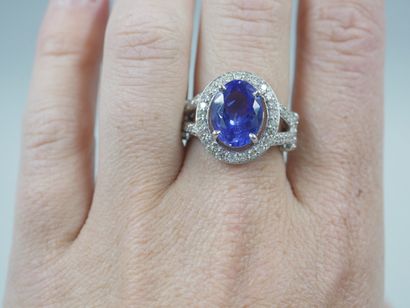 null 18k white gold ring set with an oval tanzanite of about 4cts in a diamond setting....