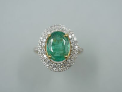 18k yellow gold ring set with an oval emerald...