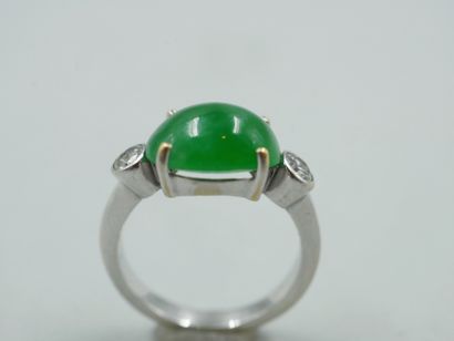 null Ring in 18k white gold topped by an oval jade cabochon with two diamonds. 

PB...