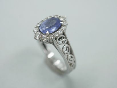 null 14k white gold pompadour ring set with an oval sapphire in a diamond setting...