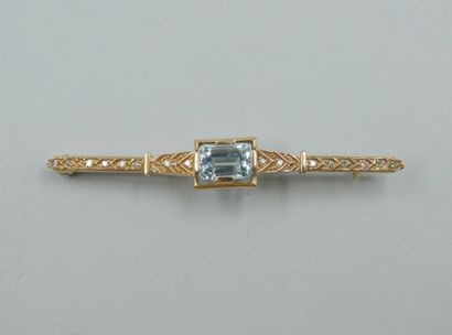 null Yellow and 14k white gold barrette brooch topped with an emerald-cut aquamarine...