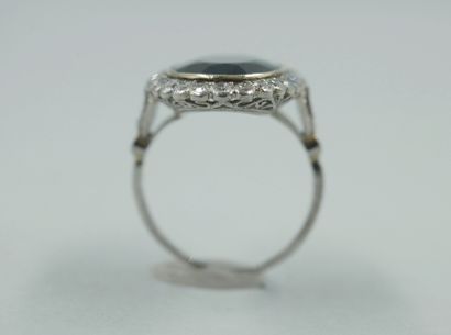 null Platinum ring set with an oval sapphire of about 6cts in a diamond setting....