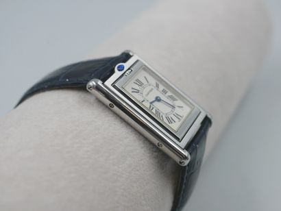 null 
CASE, TILTING TANK

Steel watch with rectangular case set with a sapphire in...