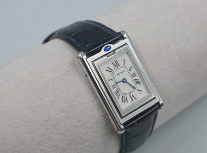 null 
CASE, TILTING TANK

Steel watch with rectangular case set with a sapphire in...