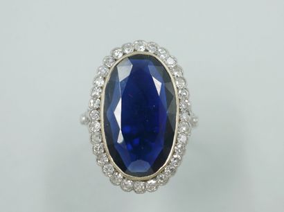null Platinum ring set with an oval sapphire of about 6cts in a diamond setting....