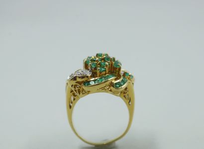 null 18k yellow and white gold flower ring set with round and calibrated emeralds...