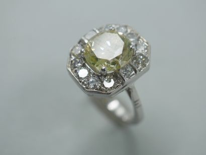null 18k white gold ring set with a 2.75ct yellow diamond in an octagonal diamond-paved...