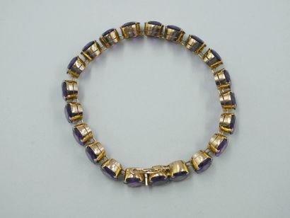 null Bracelet in 14k yellow gold set with 21 oval amethysts in claw setting.

PB...