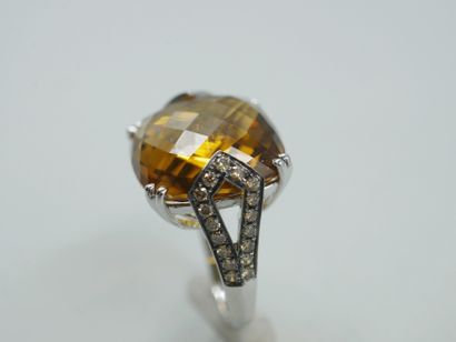 null 18k white gold and rhodium ring set with a faceted cushion-cut citrine in an...