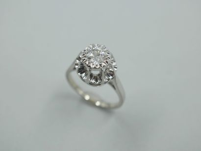null Solitaire ring in 18k white gold and platinum surmounted by an old-cut diamond...