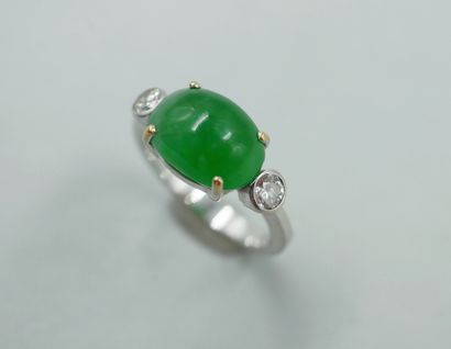 null Ring in 18k white gold topped by an oval jade cabochon with two diamonds. 

PB...