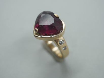 null 14k yellow gold heart ring with a heart-shaped ruby, probably treated, punctuated...