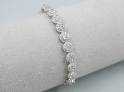 null Bracelet in 18k white gold set on the top with eleven circular motifs paved...
