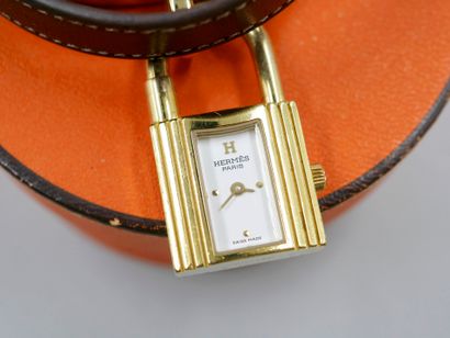 null HERMES Paris. Kelly" model. 

Gold-plated lady's watch, padlock dial, double-turn...