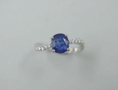 null 18k white gold ring set with an oval sapphire weighing approximately 1.20cts,...