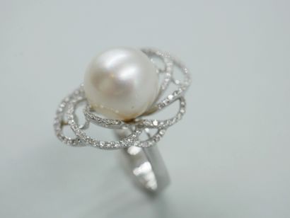 null 18k white gold ring centered on a South Sea pearl, 12mm diameter, in a swirling...